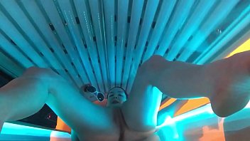 Busty Slut Gets Herself Off in Public Tanning Bed